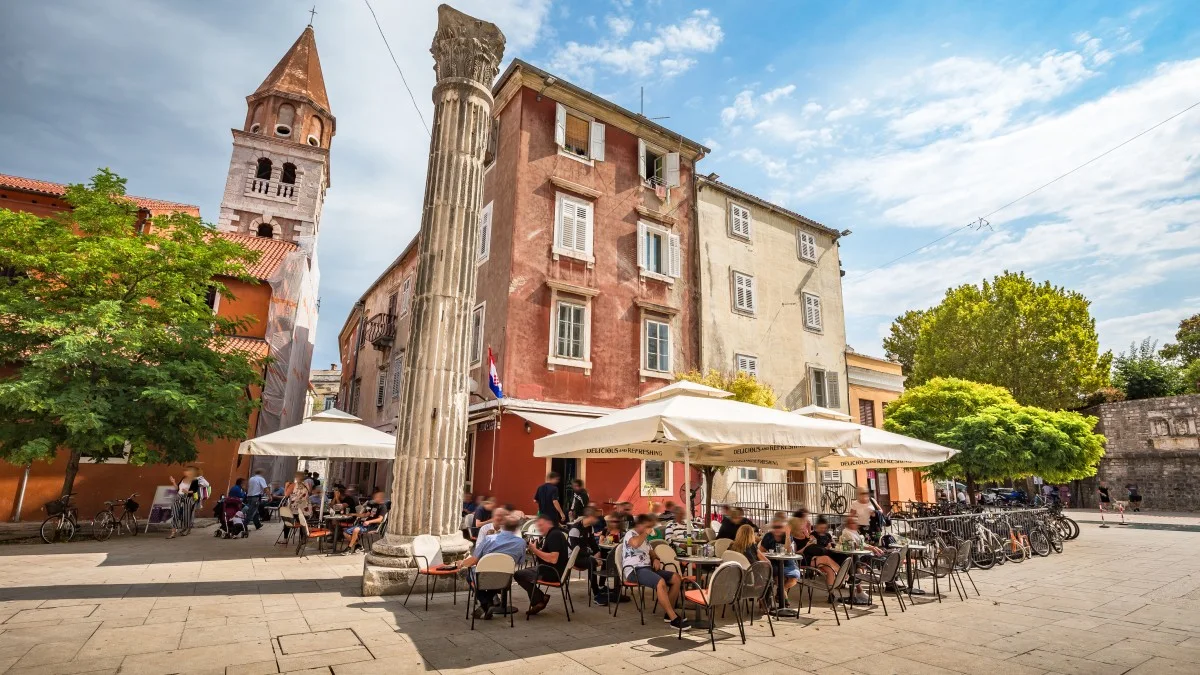 Beautiful panoramic view of idyllic scenery in the ancient roman city center of Zadar with historic church of St. Simeon on a beautiful sunny day 