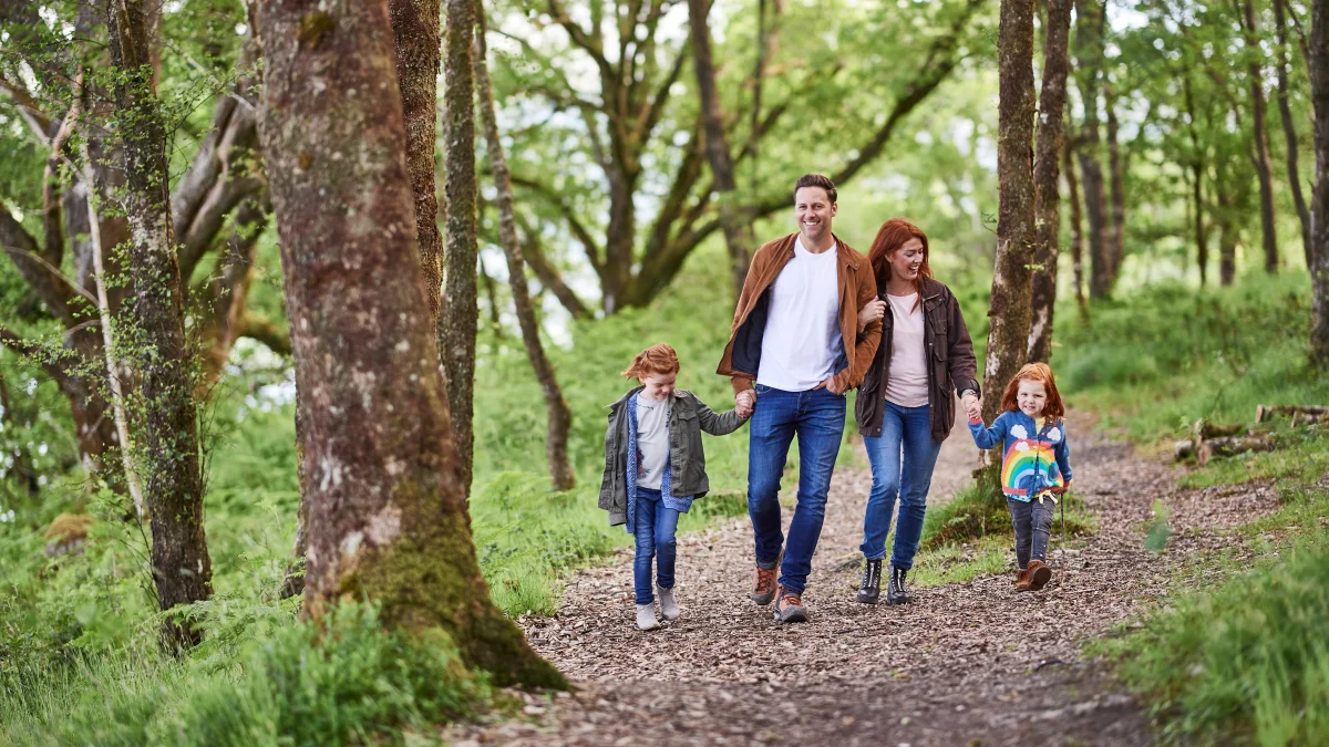 Family walking in the woods together