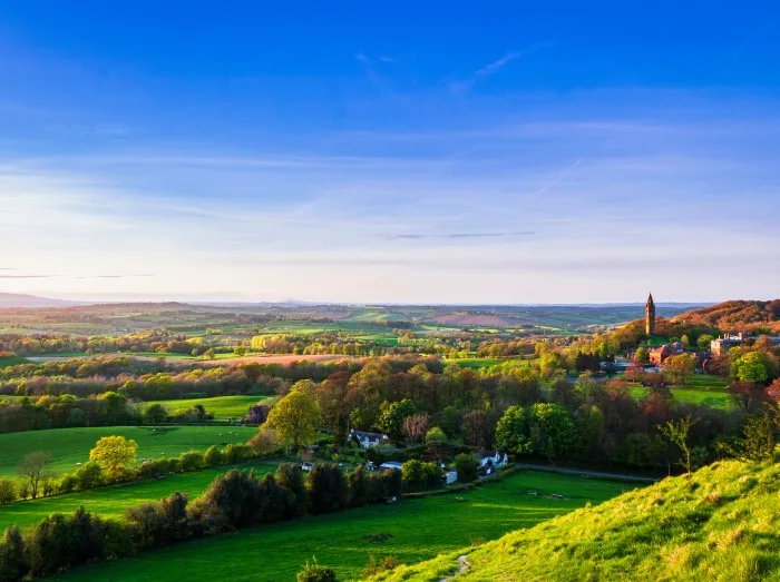 View of Abberley clock tower at sunset during late April from Walsgrove hill near Great Witley in Worcestershire west midlands England