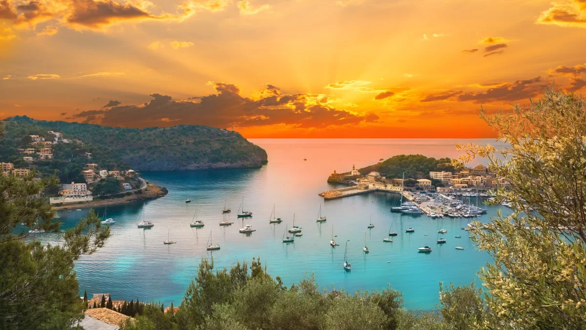 View of the famous Soller Port Marina and Dockland illuminated by sunset light in Palma de Majorca in Spain in summer season