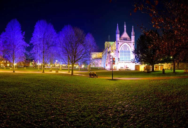 Night-time view of Winchester Cathedral at Christmas, England, UK