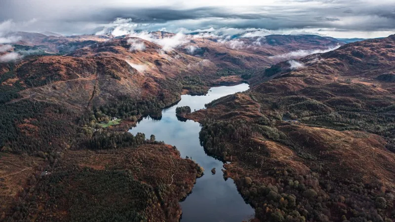 Drifting over mountain peaks in Loch Trool, Scotland