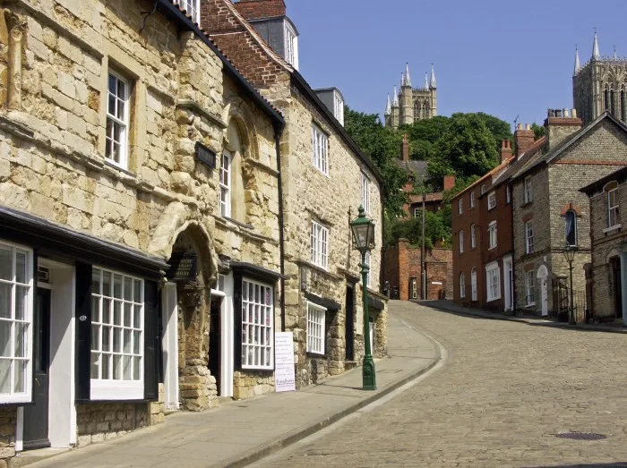 Historic Buildings in Steep Hill Lincoln, with the Towers of Lincoln Cathedral towering over head, City of Lincoln, Lincolnshire,