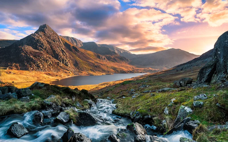 A rushing river flowing through the mountains of wales