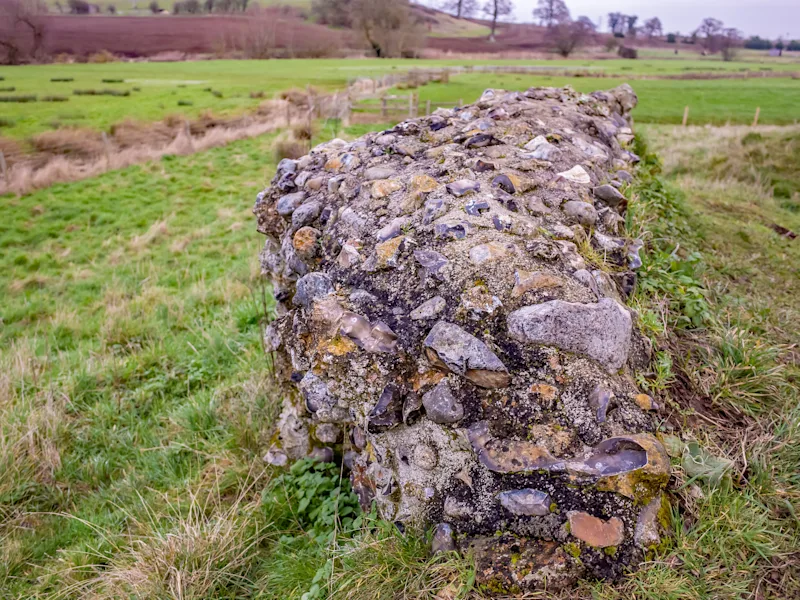 Section of stone wall at the ruins of the Roman town in Caistor St Edmund in the county of Norfolk, England, UK