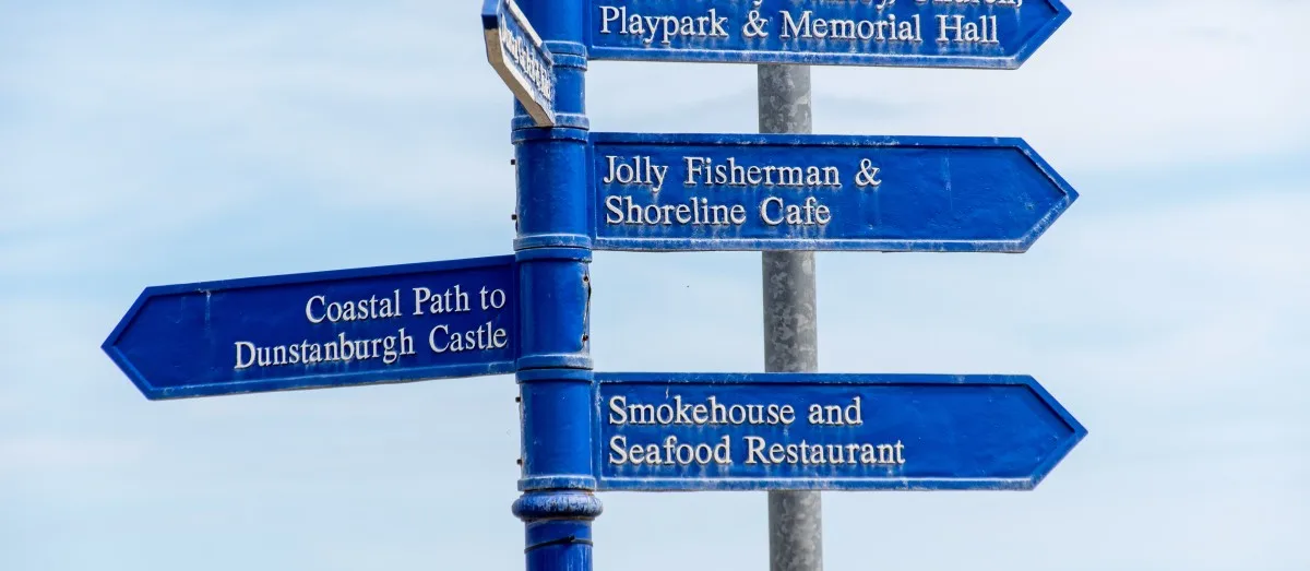 Street sign and directions in fishing village Craster. Northumberland