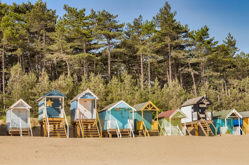 Colourful beach huts on the beach at Wells-next-the-Sea on the North Norfolk Coast, UK