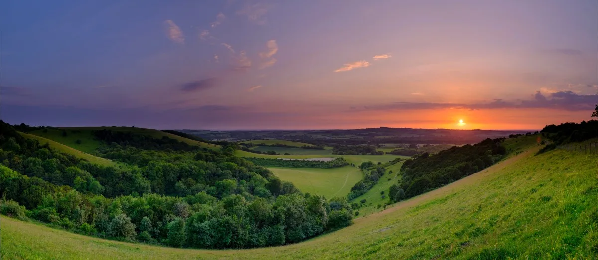 Sunset over Beacon Hill from Old Winchester Hill in the South Downs National Park near Warnford, Hampshire, England