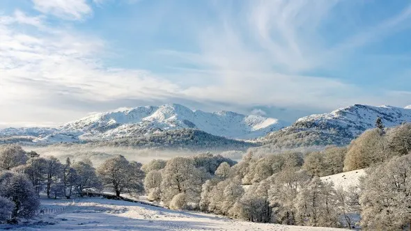 Lake District National Park, Cumbria, England, UK. Winter landscape. S.W. over Langdale to Wetherlam mountain from Loughrigg