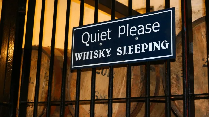 Quiet Please Whiskey Sleeping Sign with Barrels of Whiskey