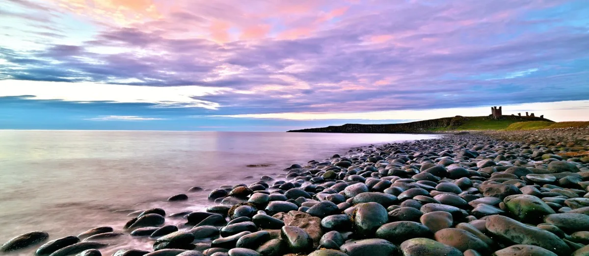 View of purple sky on the Northumberland Coast in England