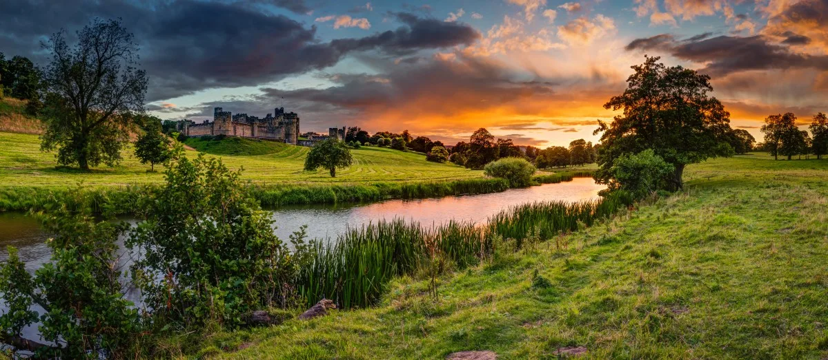 Panoramic Sunset over River Aln / The River Aln runs through Northumberland from Alnham to Alnmouth. Seen here in panorama below Alnwick Town and Castle on the skyline