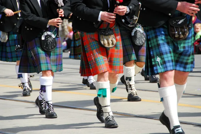 Scottish marching band wearing traditional kilts