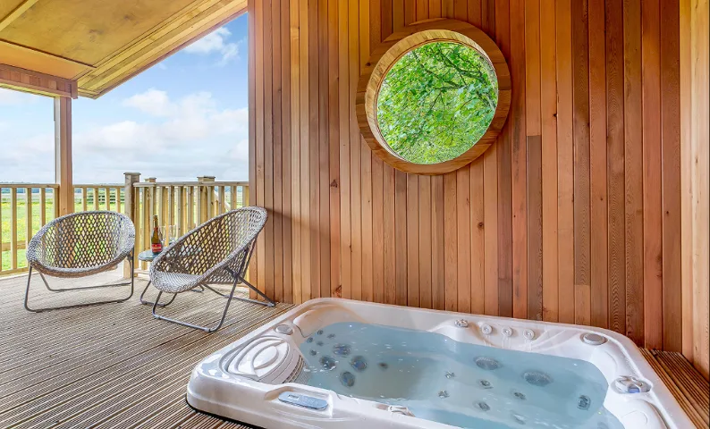 Snug among the trees, this chic timber-clad lodge is made for two. Think sunset dips in the outdoor hot tub, and mornings that start slow with coffee on the deck.