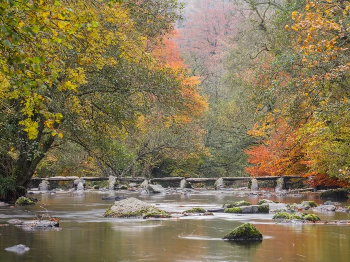 Tarr Steps, a clapper bridge across the River Barle. Exmoor National Park, Somerset,