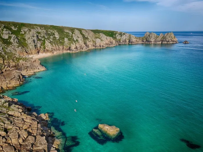 Pedn Vounder Beach with Logan Rock