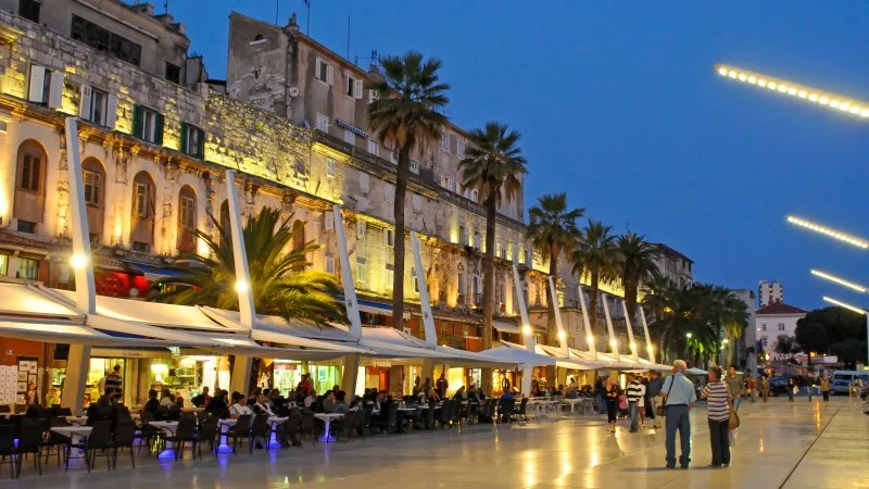 Riva waterfront along the walls of the Diocletian Palace at dusk, Split