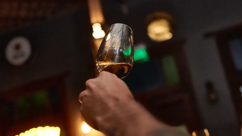 Close-Up of Whiskey Tasting Event Featuring a Variety of Fine Whiskeys in Glasses, Highlighting Rich Aromas, Flavors, and the Art of Distilled Spirits 