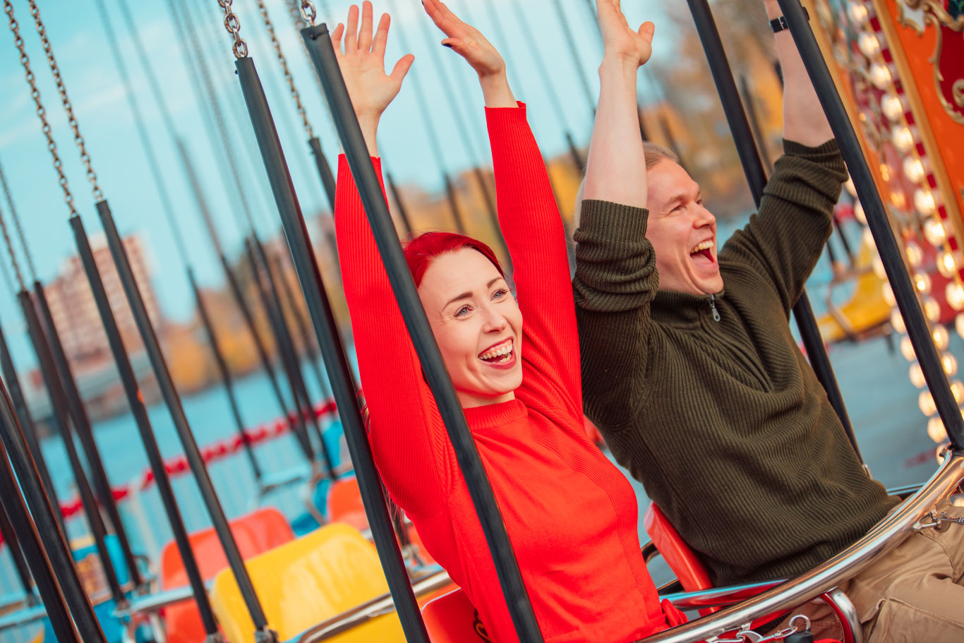 Couple at Swing Carousel ride at Särkänniemi.