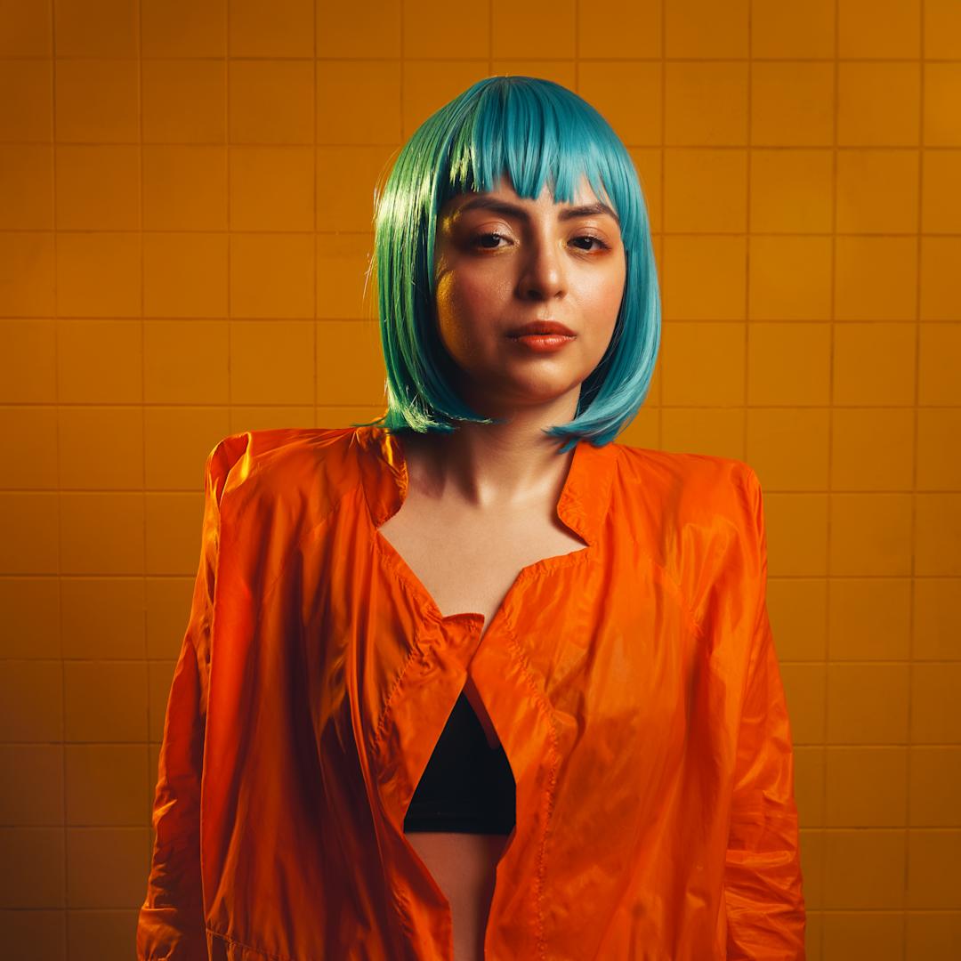 woman in a turquoise wig