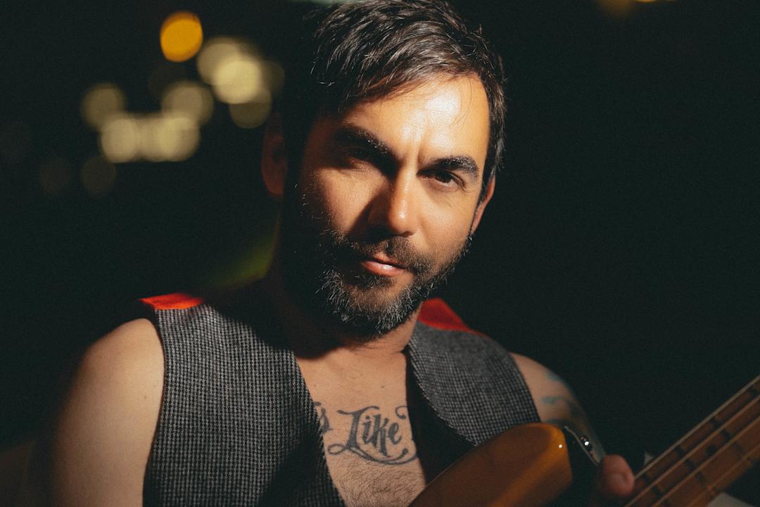 a man in a vest
