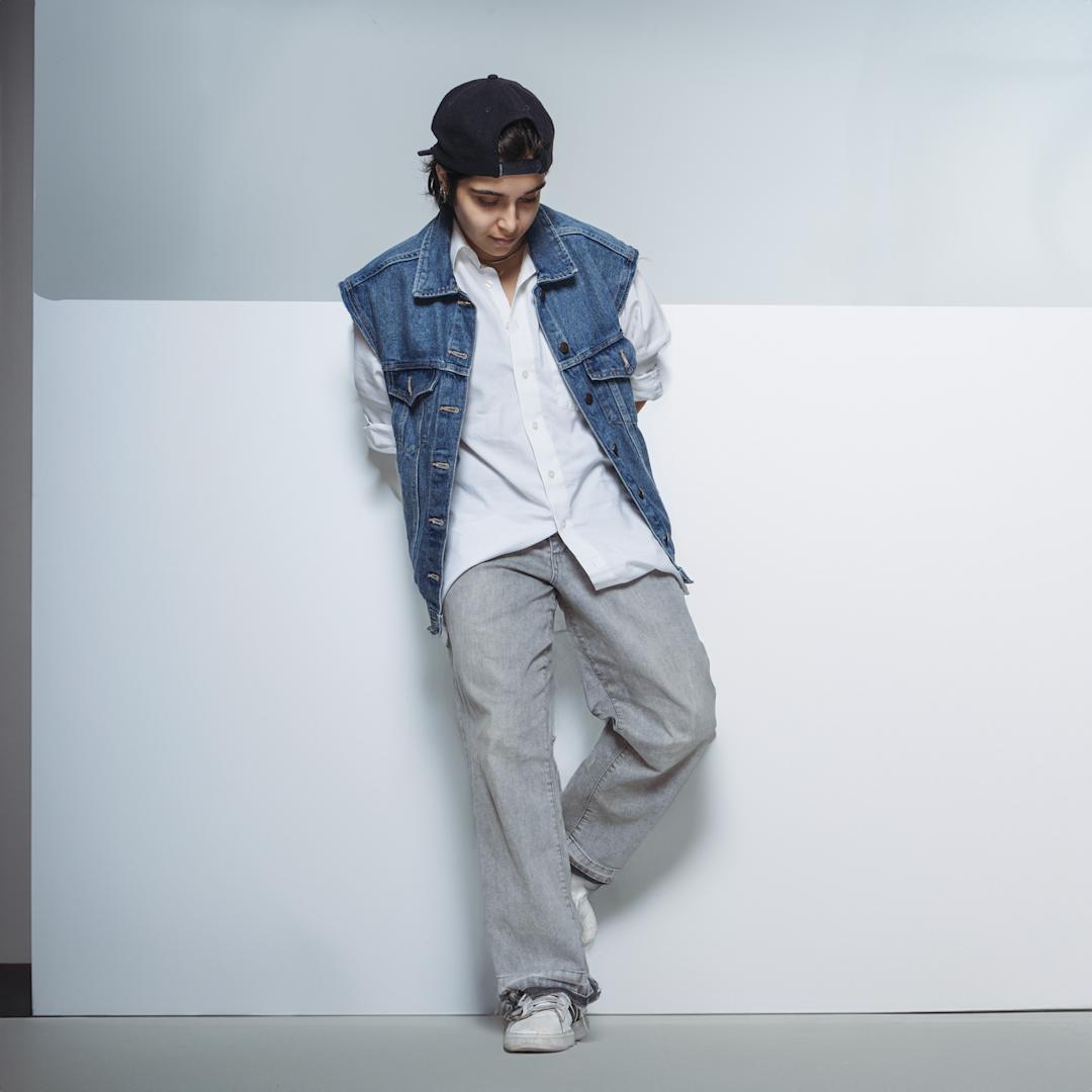 Termeh standing against a wall