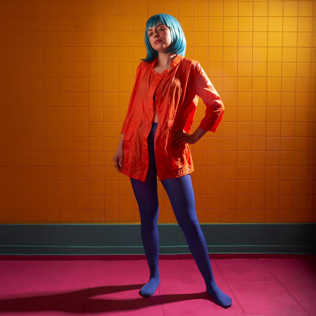 Woman in blue tights posing