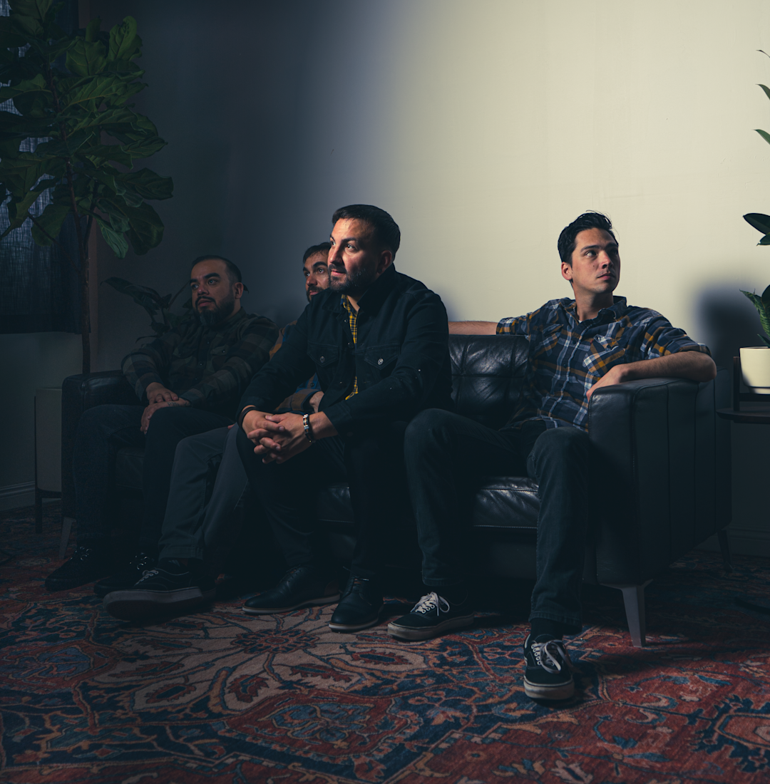 a group of guys sitting on a couch