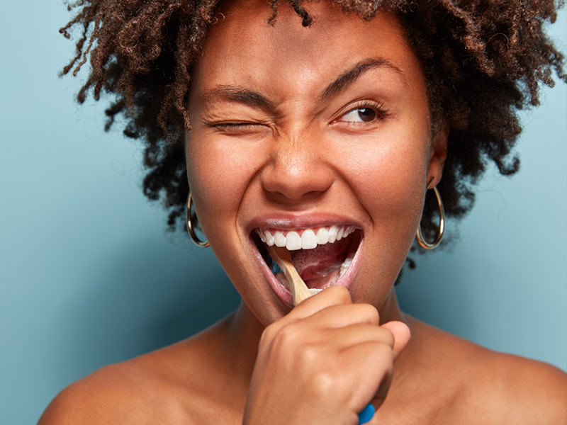 Woman brushing her teeth