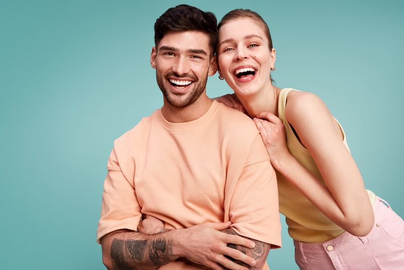 Man and woman smiling with a perfect smile