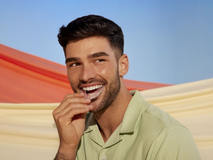 Man with dental aligners