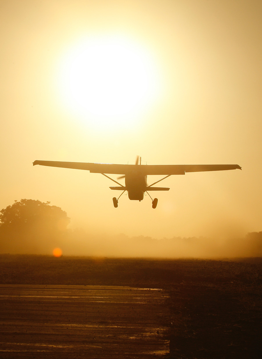 Plane Taking Off into the Sunset in Zimbabwe - ROAR AFRICA