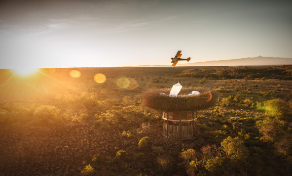 Airplane over Field in Kenya with Beautiful View on Luxury Safari - ROAR AFRICA