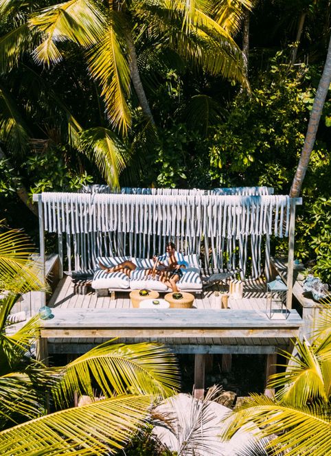 Couple Lounging under Cabana on Safari in Seychelles - ROAR AFRICA