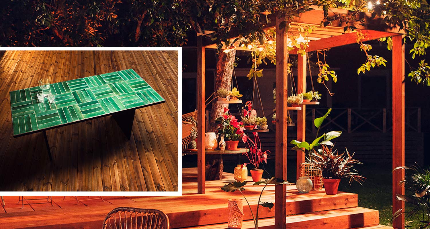 Vihreä laattapöytä ja itse tehty pergola tunnelmallisella terassilla