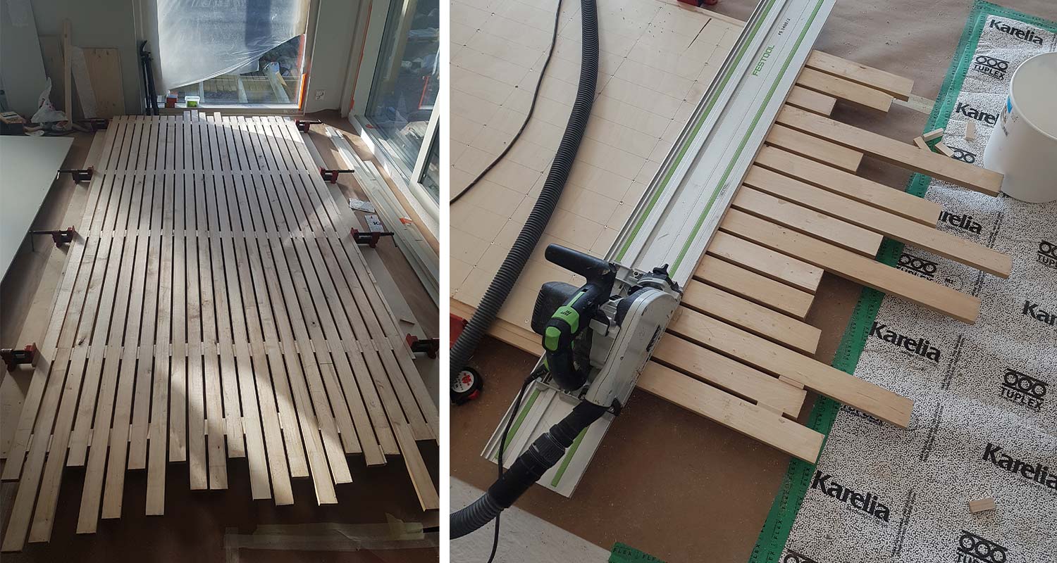 Vaalea puuritilä lattialla asennettavana, Festool-saha, imuletku ja Karelia-eriste.