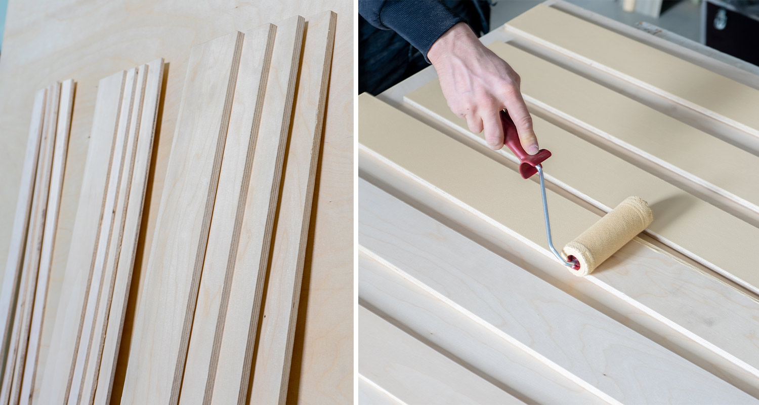 Käsi maalaa rullan avulla vaaleabeigejä koivulistoja, vieressä käsittelemättömiä puulistoja.