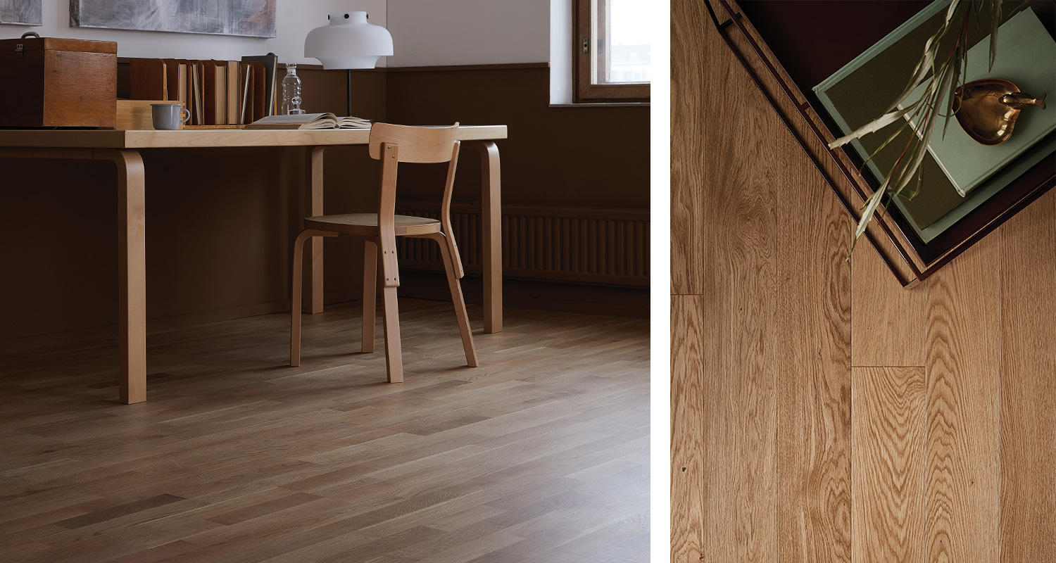 Kotitoimisto vaalealla tammiparketilla: koivupöytä ja -tuoli, kirjoja ja messinkipäärynä