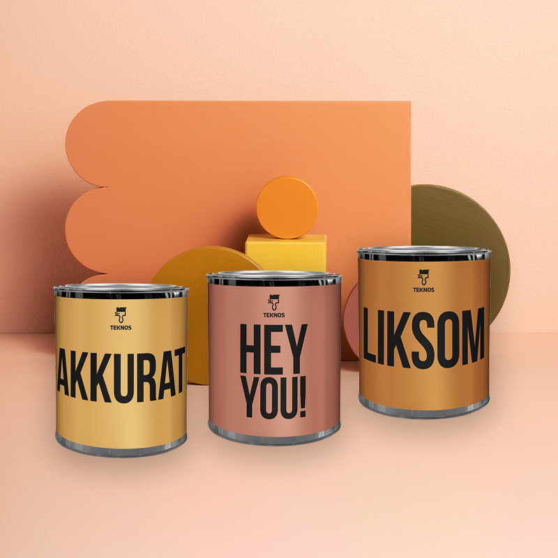 Kuvassa Teknoksen miniväripurkkeja. Taustalla aprikoosin sävyistä seinää kuvioiden kera, jotka on maalattu miniväripurkeilla. Löydät ne K-Raudasta!