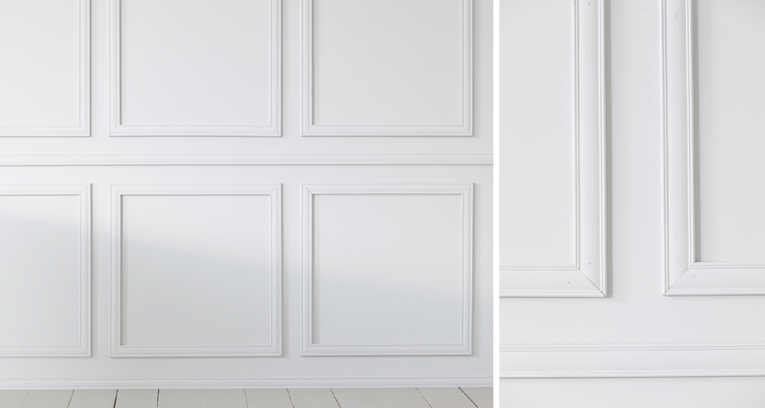 Valkoinen sisäseinä kuudella suorakaiteen muotoisella listapaneelilla ja vaalea puulattia