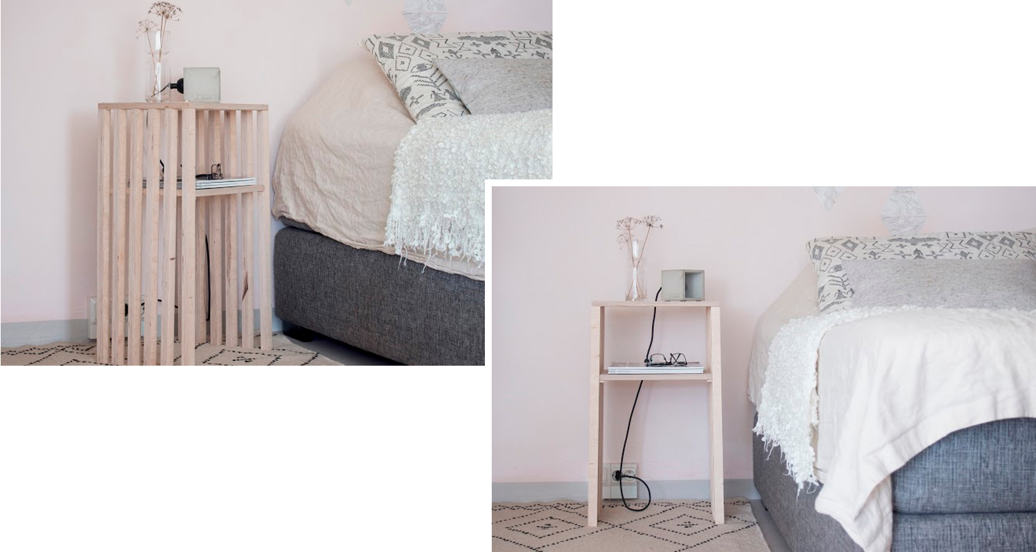 Vaalea puuyöpöytä vaaleanpunaisen seinän edessä, maljakko, lamppu ja harmaa sängynurkkaus.