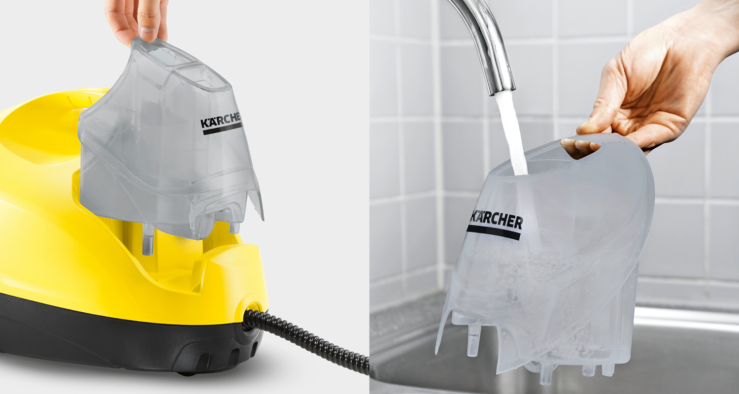 Keltainen Kärcher-höyrypuhdistin, harmaa läpinäkyvä vesisäiliö irrotettuna ja hanassa täyttymässä.