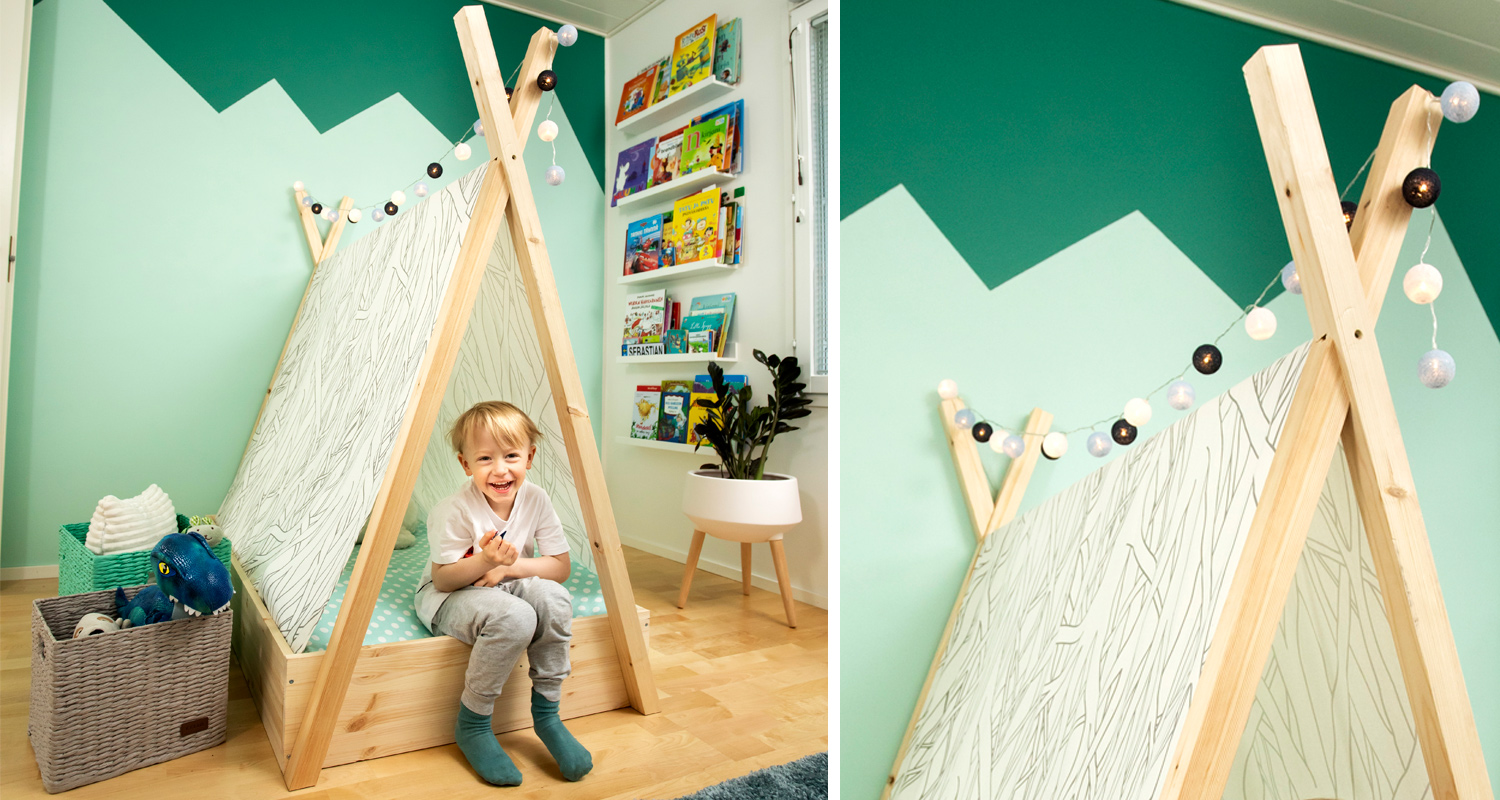 Lastenhuoneessa puinen telttasänky mintunvihreää seinää vasten, hylly kirjoille ja lelukori