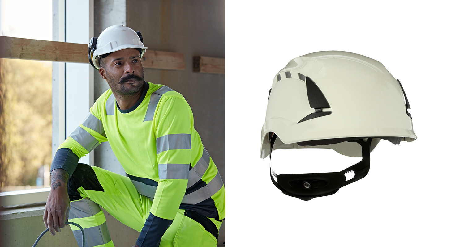 Työmies työmaalla suojakypärän kanssa