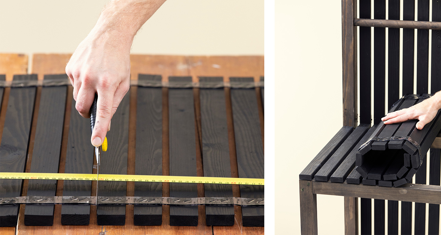 Käsi veitsellä leikkaa mustia puusäleitä keltaisen mittanauhan mukaan puupenkillä.
