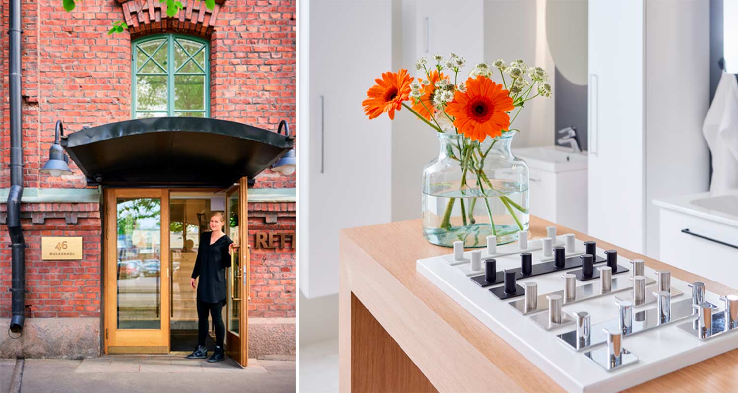 Punatiilisen sisäänkäynnin musta katos ja oransseja gerberoita maljakossa metallinäytteiden vieressä.