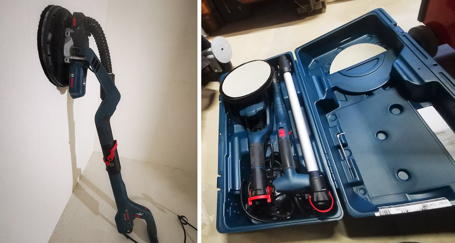 Ammattilaisella testissä varsihiomakone Bosch, salkku avattuna ja kone seinää vasten