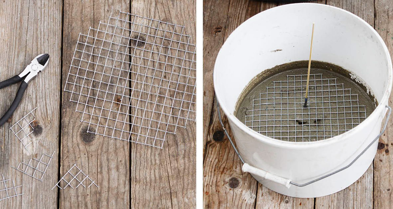 Puisella pöydällä metalliverkkoja, vieressä valkoinen ämpäri harmaalla betonilla ja verkolla.