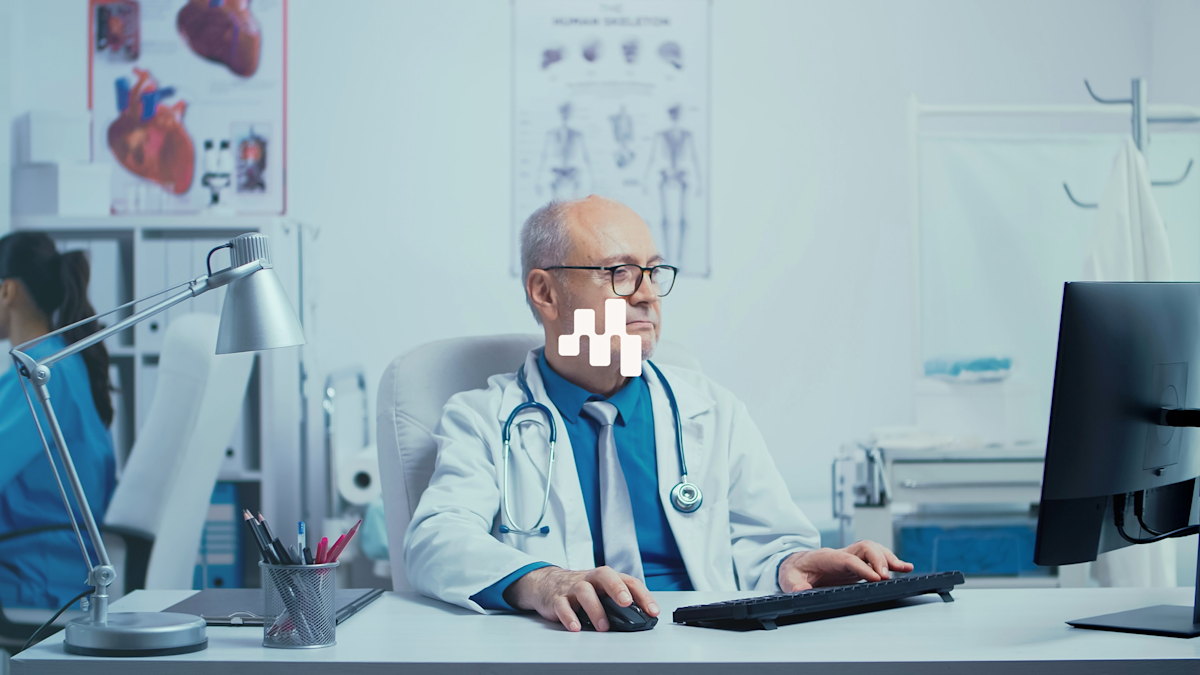 Man in chair with Motics logo