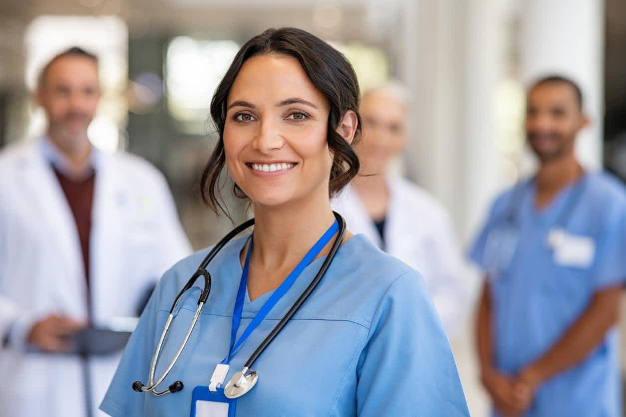 Charge Nurse in the hospital with doctors and nurses